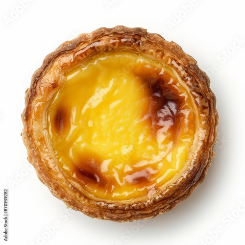 A delicious Portuguese pastel de nata, a custard tart with a crispy, flaky crust, isolated on white background.