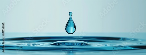  A drop of water falls into a pool, causing a ripple effect; another drop emerges from the surface