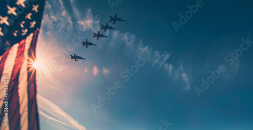 American fighter jets flying by the American flag 