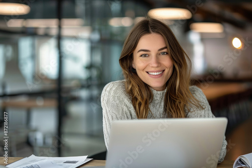 Happy busy mature business woman entrepreneur in office using laptop at work, smiling professional middle aged female company executive manager working looking at computer at workplace