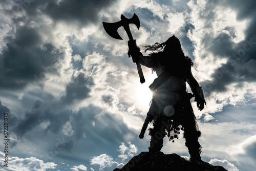 Barbarian Triumph: Silhouette of a Victorious King with Raised Ax, Symbolizing Power and Leadership in Battle - A Legendary Moment of Conquest. Copy Space.