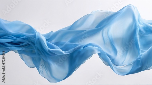 A close-up image showcasing the exquisite texture and elegant drape of flowing blue chiffon fabric. The soft folds and gentle ripples create a sense of ethereal beauty and delicate sensuality. 