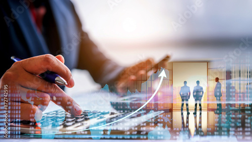 double exposure of businessman using laptop at office with financial info graph show rising , financial and investment concept 