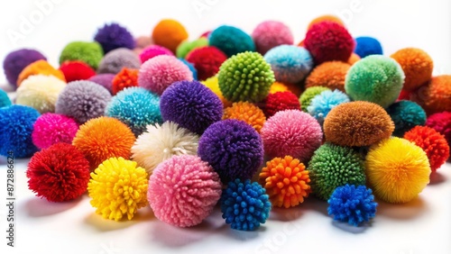 Vibrant colored pom poms in various sizes and shapes scattered randomly on a white background with slight shadows and depth.