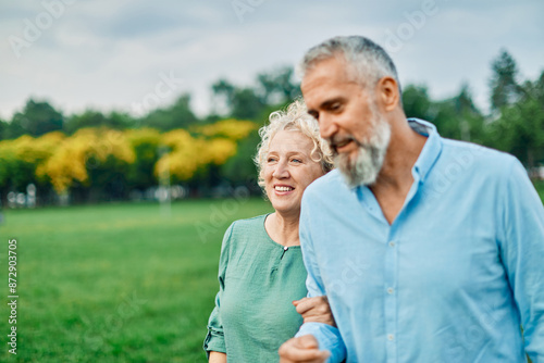 woman portrait mature couple happy together active bonding park outdoor middle aged man talking leisure park fun smiling love old middle mid aged nature wife walking