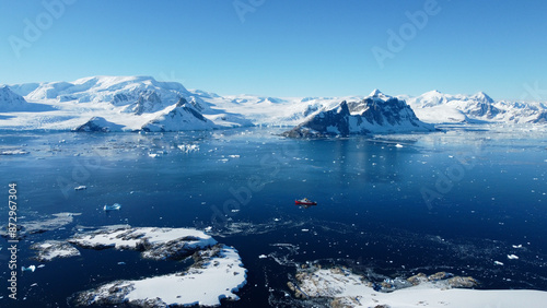 Large vessel in the Southern Ocean, Antarctica. Little boat in the big Ocean. Track from the boat in the frozen ocean