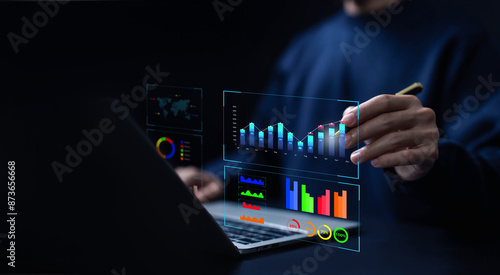 analyst manages the system database, analytics business and reports on the computer. concept of analysis data plans shows a dashboard chart, research on platform digital technology