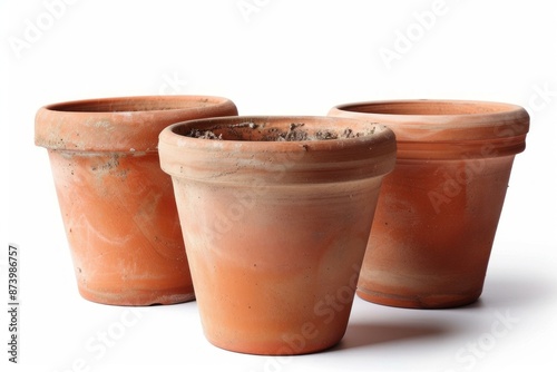 Trio of empty clay pots against a white background, perfect for gardening themes