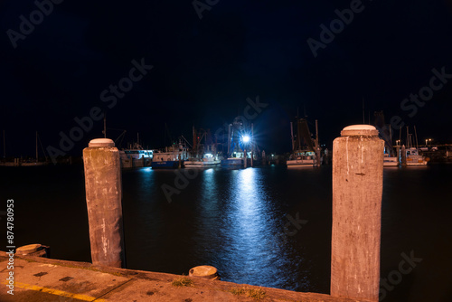 Night scene of fishing wharf and marina Coffs harbour Wharf at night.