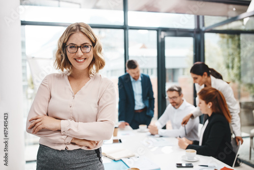 Crossed arms, manager and portrait of business woman in office with confidence for career growth. Smile, pride and female finance banker with team for company investment with meeting in boardroom.