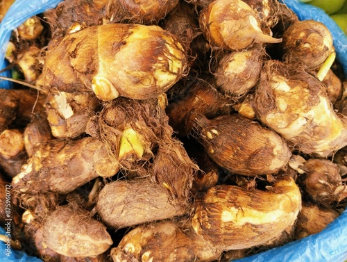 Closeup of taro root vegetable starchy food closeup arbi arvi taroroot colocasia esculenta inhame, inhame-coco, matabala, malanga, tropical plant rootfood, colocasia esculenta, eddo, dasheen photo 