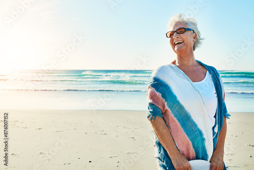 Beach, travel and senior woman with smile for vacation, weekend holiday and adventure in Florida. Ocean, elderly person and sunglasses for sunshine, peaceful and happiness in retirement by mockup