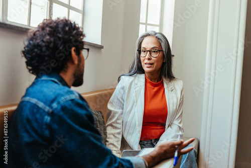 Manager having a creative conversation with a team member at work