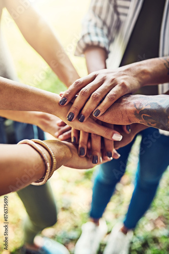 Hands, together and stack for team building with people outdoor, support and solidarity in nature. Community, mission and partnership, trust and commitment with loyalty, group huddle and agreement