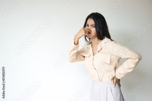 Stinking Odor and Disgusted Expression, Asian Woman Reacting to Unpleasant Smell Concept Image