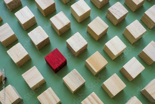 Abstract composition of cubes and red one symbolizing individuality.