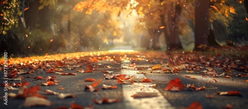 Autumn leaves covering the road in a picturesque scene with abundant copy space image