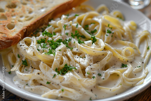 Creamy Fettuccine Alfredo Pasta with Garlic Bread on the Side