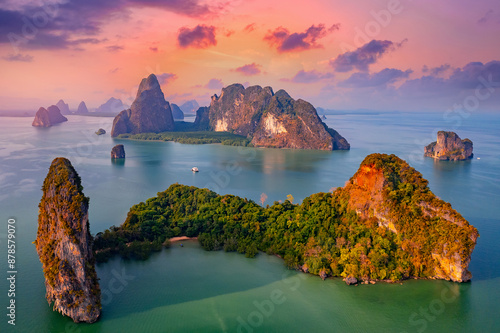 Sunset beautiful landscape of nature Thailand, Long tail boat with tourist on Hong tropical island and Phang Nga bay in turquoise sea, aerial view