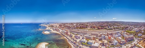 Drone panorama over the Italian city of Civitavecchia with harbor and cruise ships during the day