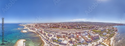 Drone panorama over the Italian city of Civitavecchia with harbor and cruise ships during the day