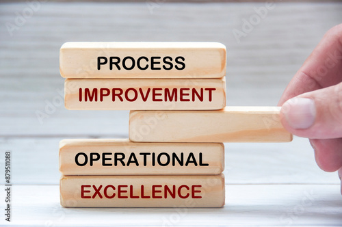 Process improvement and operational excellence text on wooden blocks. Operational excellence concept