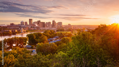 Saint Paul, Minnesota, USA. Aerial cityscape image of downtown St. Paul, Minnesota, USA with reflection of the skyline in Mississippi River at beautiful summer sunrise.