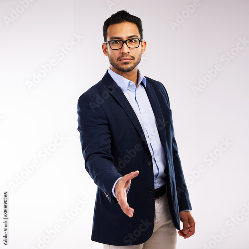 Portrait, handshake and business man in studio for agreement, interview or deal on white background. Welcome, corporate and Asian person with introduction for greeting, thank you or job opportunity