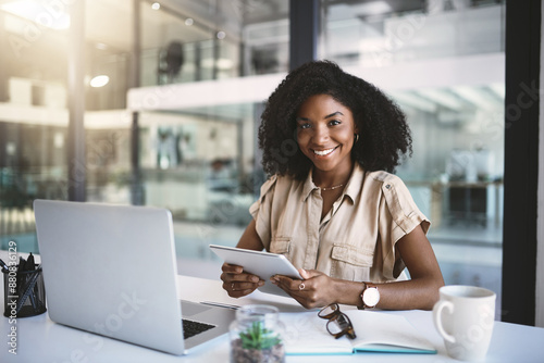 Laptop, tablet and portrait of black woman in office with notes, planning or happy corporate advisor at desk. Businesswoman, online consultant or confident business development manager on digital app