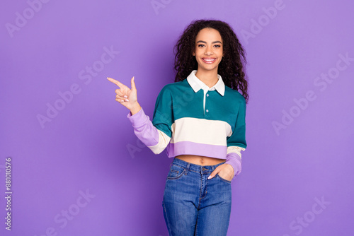 Photo of nice young girl indicate finger empty space wear shirt isolated on violet color background