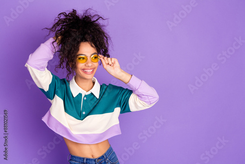 Photo of nice young girl touch hair look empty space wear shirt isolated on violet color background