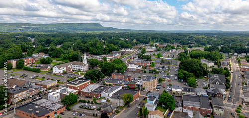 Southington, CT Downtown Aerial Image. High Quality view of downtown Southington overlooking the center and green by Town Hall and the Congregational Church. Many local shops and businesses shown.