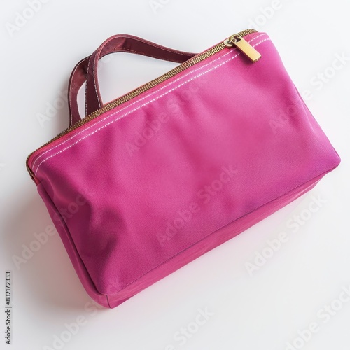 Top view of magenta travel toiletry bag isolated on white background. 