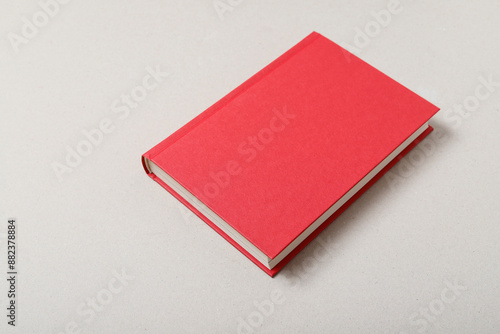 Big red book isolated on grey background, copy space.