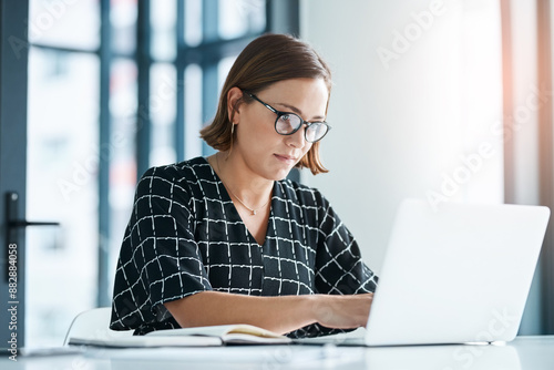 Office, woman and typing on laptop for proposal email, application and requirements to stakeholder. Grant writer, online and research funding for non profit organization, submission and review.