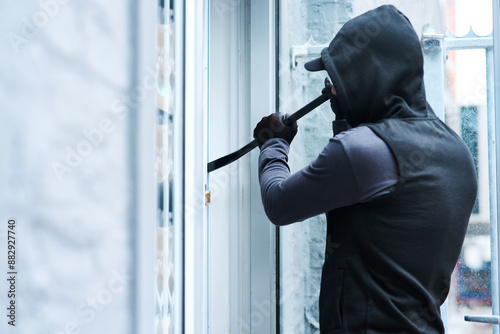 Man, criminal and crowbar for house crime, home invasion and breaking entering attempt with tool. Apartment, robbery and burglary or trespassing on property, security breach and owners safety risk