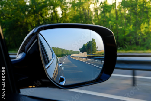 look in the rear view mirror of a car