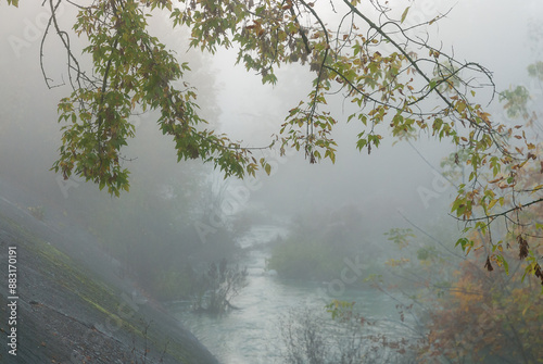 Fog on a small river on an autumn morning, natural background.