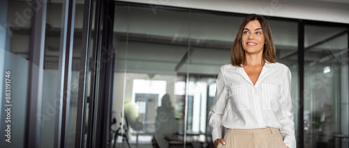 Successful hispanic senior business woman standing confident proudly smiling aside. European Latin 40s years mature good looking middle age leader female businesswoman in office. Banner, copy space.