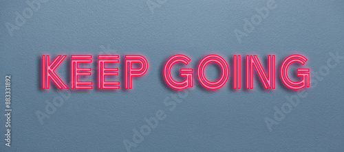 Keep going neon sign on a wall