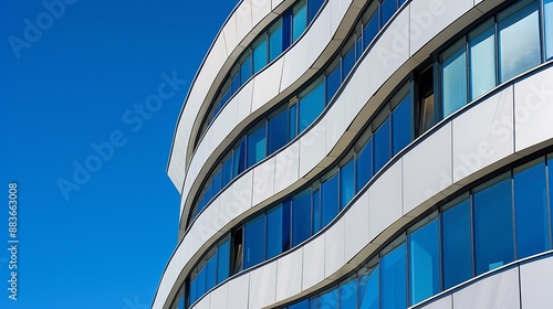 A modern building with interesting architectural curves in Novi Sad Serbia Picture taken on a bright blue sky day Shadows falling perfectly on the building : Generative AI