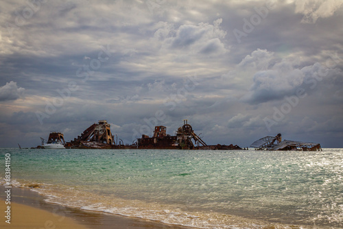 A successful artificial reef made of wrecked ships, under an overcast sky at Moreton Island, a popular tourist destination in Moreton Bay off Brisbane, the capital of Queensland, Queensland, Australia