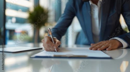 Business professional signing a commercial lease in a modern office space, symbolizing business growth and new opportunities