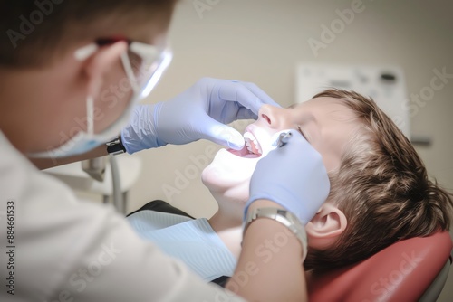 A dentist examining a patients teeth in a dental clinic