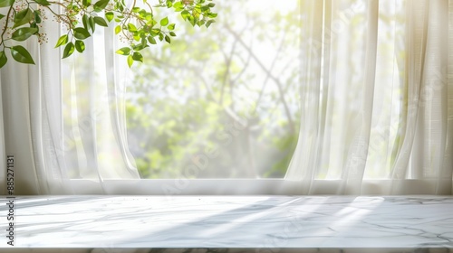 Sunlight streams through white curtains onto a marble windowsill