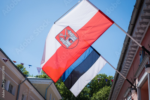 Tartu, Estonia - May 25, 2024: Close-up of Tartu city flag and Estonian flag. Flag of Tartu.