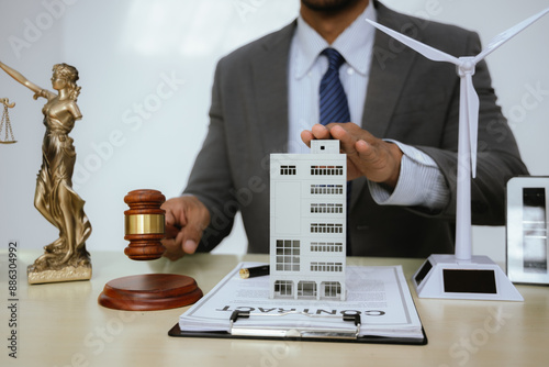 A lawyer specializing in real estate law handles property sales, mortgages, and litigation. They represent clients in court, advising on investments, taxes, and foreclosures, ensuring justice and prot