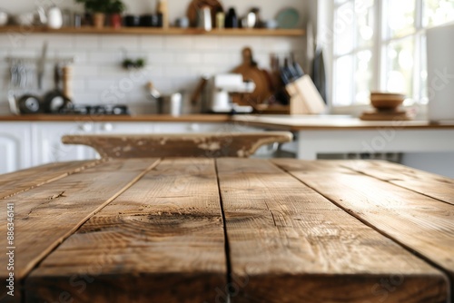 A low angle shot of an empty wooden dining table in a bright kitchen