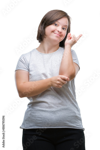 Young adult woman with down syndrome over isolated background with a big smile on face, pointing with hand and finger to the side looking at the camera.