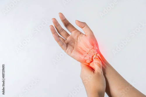 Closeup of male arms holding his painful wrist caused by prolonged work on the computer.